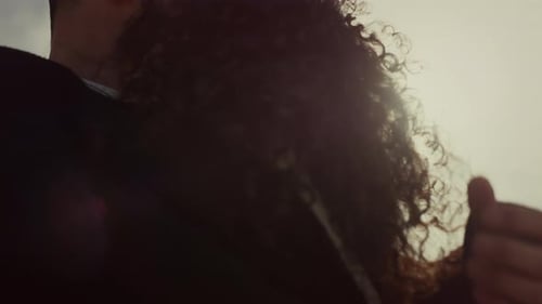 Lovers Embrace on a Sunny Beach