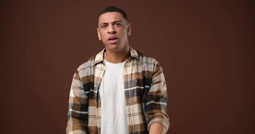African American Man Upset About Dismissal Unlucky Day Standing Over Brown Studio Background