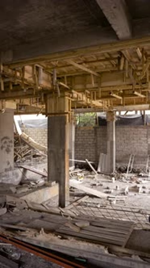Overview Inside Building Under Construction with Scaffolding Wooden Beams