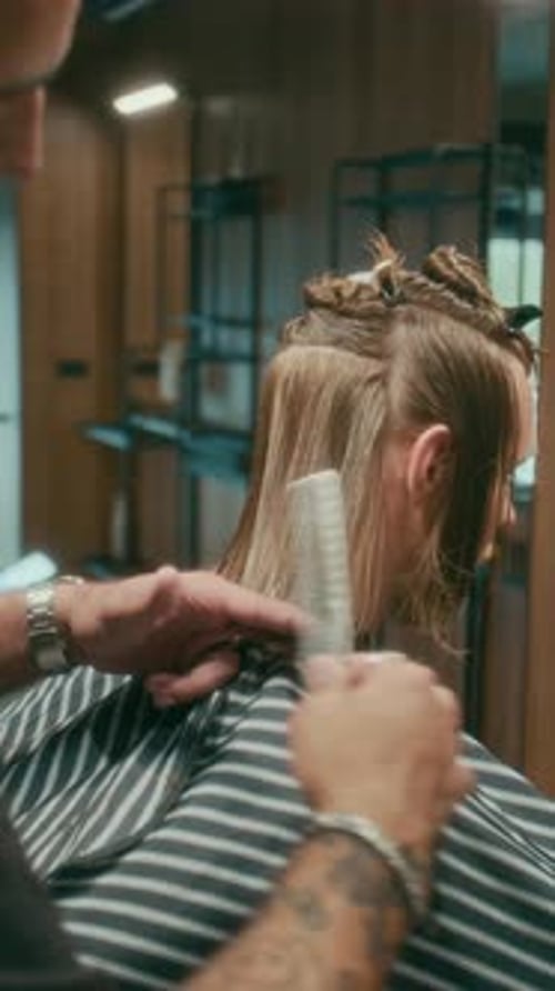 Man getting haircut at a barber shop