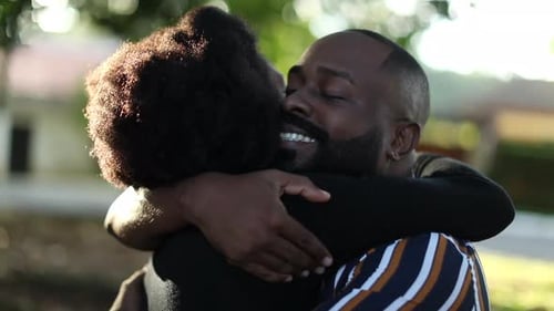 Loving Couple Embracing in a Sunny Garden