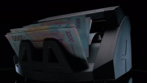 Ukrainian Hryvnia Banknotes In Money Counter
