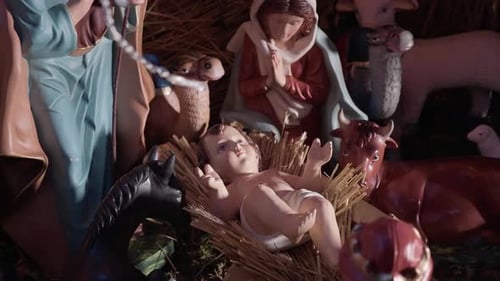 Close up of nativity scene with baby Jesus in a manger