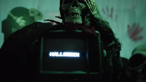 Skull With Damaged Noise TV And Halloween Text Appearing