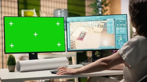 Developer in a Corporate Workspace Analyzing Master Plans with Mockup Screen
