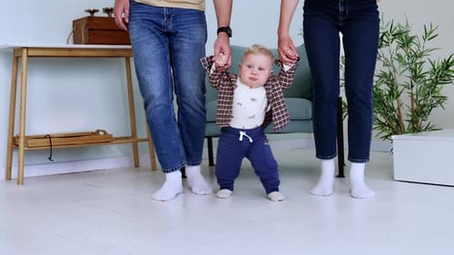Baby's First Steps with Loving Family at Home