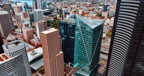 Drone descending along the high-rise buildings in the downtown of Seattle, Washington, US.