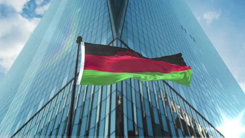 Malawi National Flag Waving in Front of Modern Corporate Building