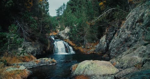 Flowing Water in Mountain River Waterfall Slow Motion Shot