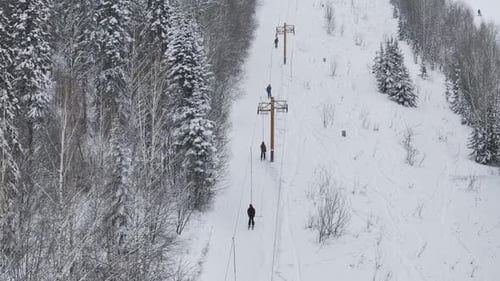 Ski Lift Rope Tow Snowy Ski Resort Rope Tow in Winter Forest Setting Aerial View Ski Lift Rope Tow