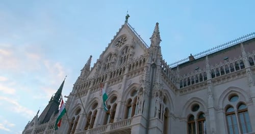 Budapest Parliament with Flags in Day Light