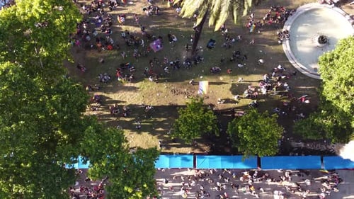 Drone view above crowded park of Buenos Aires, during the LGBTQIA+ Pride Parade - birds eye, drone s