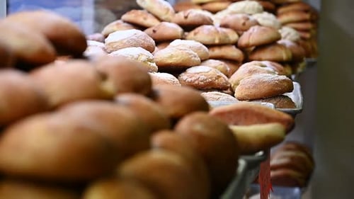 Abundant Buns Stacked High in Bakery Display