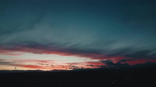 Sunrise Over Cityscape: Aerial View of Vibrant Sky