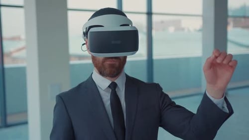 Portrait Attractive Man Making Gestures Swipe When Wearing Virtual Reality Goggles Empty Building