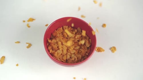 Corn Flakes Pouring Into Bowl for Breakfast