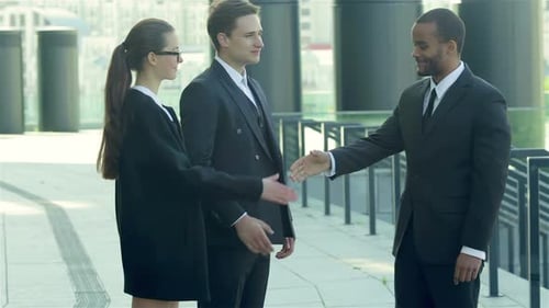 Business People Meeting, Shaking Hands and Laughing