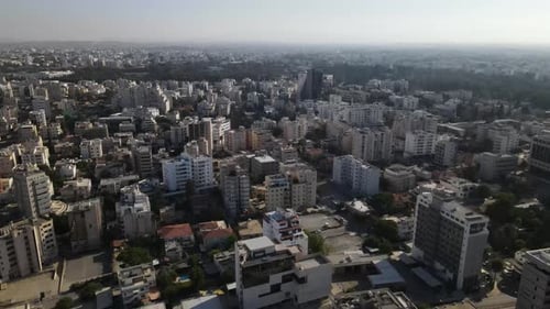 Aerial view of the evening city from above. High-rise building and urban development.