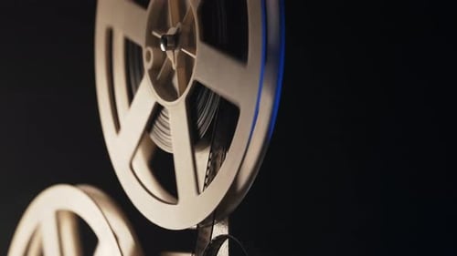 Film Spinning on Vintage Movie Projector Film Reel