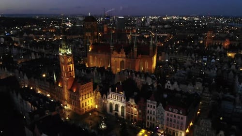 Aerial view of the illuminated Town Hall and St. Mary's Basilica in the Old Town in Gdansk. Historic