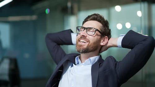 Happy Man Relaxing in Office Chair
