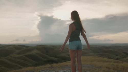 Woman enjoying scenic view at sunrise