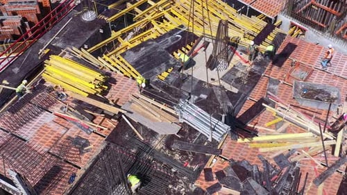 Mega Construction site with work in progress, Top down aerial view.