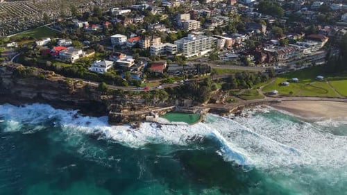 Oceanside Rock Pool And Waterfront Park At Bronte Beach In Sydney, Australia. aerial