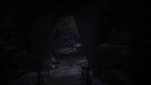Small Passage Leads Into Vast Illuminated Subterranean Space