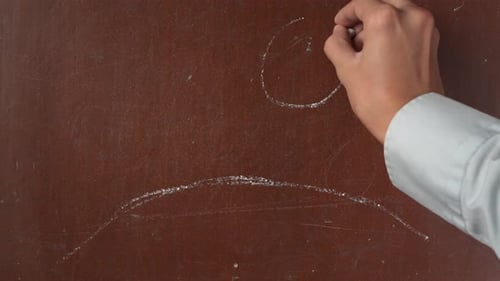 Textured Brown Chalkboard Background Male Hand Sketching a Landscape with Sun Clouds and Flowers on