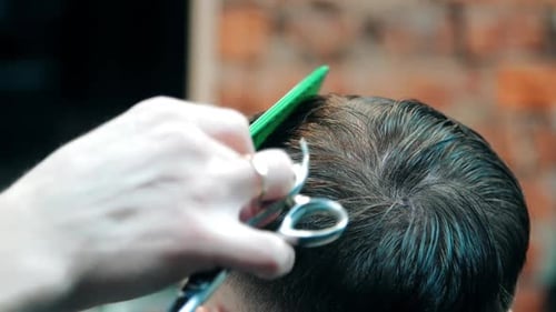 Man Getting Haircut at Barbershop Close Up View