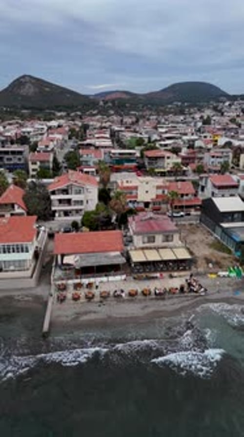 4K Drone Footage of a Seaside Venue with Outdoor Tables and Coastal View