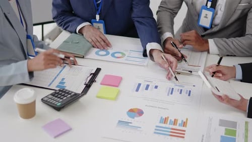 Business Professionals Reviewing Reports in an Office