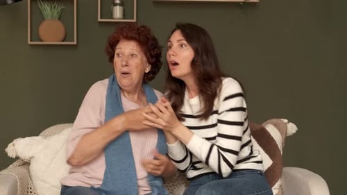 Grandmother and Adult Woman Communicate with Sign Language
