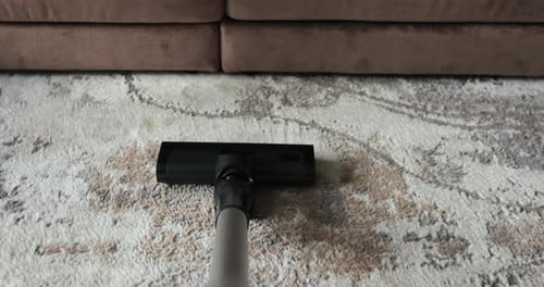 Vacuum Cleaner Cleaning Carpet at Home Close Up Shot of Vacuuming Rug Floor Modern Housekeeping