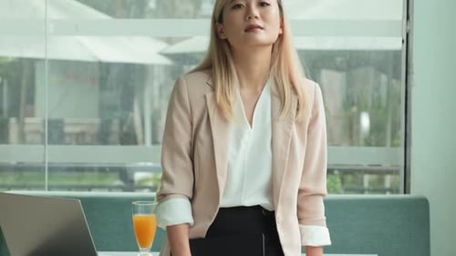 Smiling Businesswoman in Modern Office Setting