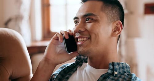 Young Adult Man Talking on Cell Phone Indoors