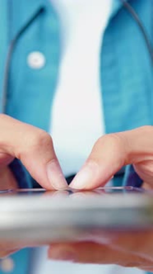 Woman Typing on Mobile Phone Device Screen