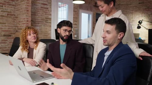 Team Discussing Project at Conference Table