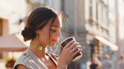 Young Woman Girl Enjoying Drinking Morning Coffee Hot Drink Relaxing Taking a Break in City Street