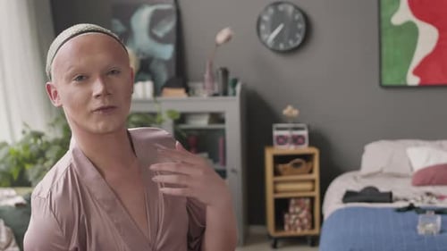 Portrait of Queer Man in Silk Robe at Home