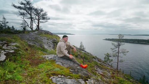 Male Traveler Resting At Top Of Mountain And Viewing Beautiful Landscape Trip In Nature