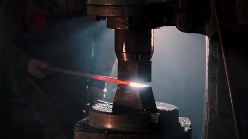 Blacksmith Forging Metal with a Mechanical Press