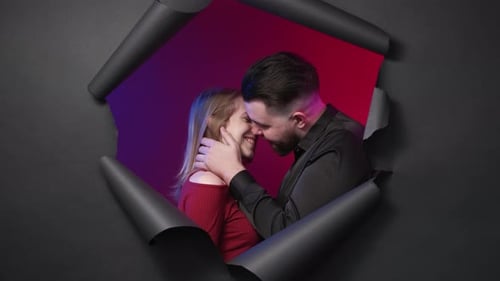 Romantic Couple Kissing Framed by Torn Paper