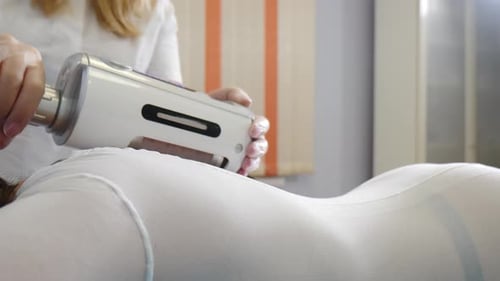 Woman Receiving Body Treatment in Clinic