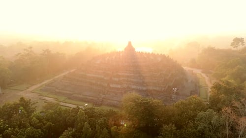 Aerial Sunrise View of Borobudur Temple with Morning Mist Central Java Indonesia