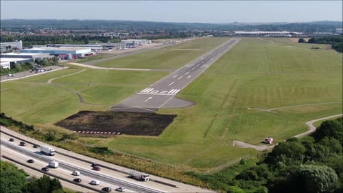 Cinematic Aerial View of a Regional Airport Runway and Infrastructure