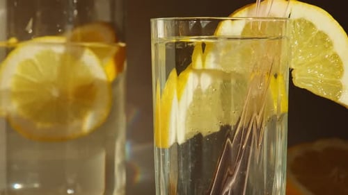 Close-up of Lemon Water in Glass with Straw