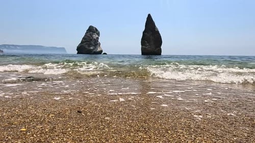 Small Sea Wave Blurred Soft Foamy Waves Washing Golden Sandy Beach and Volcanic Rocky Shores Nobody