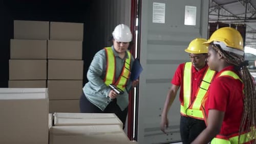 Blue collar workers working at warehouse.